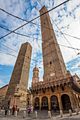 View of the Torre degli Asinelli and Torre della Garisenda from Piazza di Porta Ravegnana square. Bologna, Emilia Romagna, Italy.