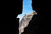 Italy, South Tyrol, Sexten, Hochpustertal, Bolzano. Hiker in silhouette on the Alpinisteig or Strada degli Alpini via ferrata, Sexten Dolomites