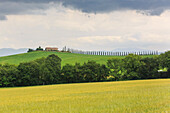 Italy, Tuscany, Orcia valley, dark clouds above farmhouse Poggio Covili at Castiglione d'orcia, provence of Siena