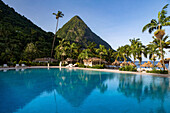 Gros Piton, UNESCO World Heritage Site, and reflection in the swimming pool at Sugar Beach, St. Lucia, Windward Islands, West Indies, Caribbean, Central America