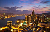Hong Kong skyline just before sunrise looking from Hong Kong Island across Victoria Harbour to Kowloon, Hong Kong, China, Asia