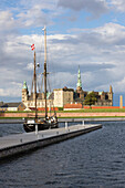 Tall ship in harbour with Kronborg Castle used as setting for Shakespeare's Hamlet, Helsingor, Zealand, Denmark, Scandinavia, Europe