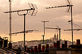 Antennas on rooftops in cityscape