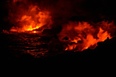 Smoke from molten lava at night