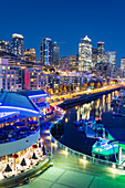 Elevated view of Seattle skyline and restaurants in Bell Harbour Marina at dusk, Belltown District, Seattle, Washington State, United States of America, North America