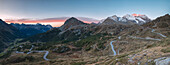 Panoramic of the road bends of Bernina Pass at dawn, Poschiavo Valley, Engadine, Canton of Graubunden, Switzerland, Europe