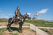 Statue of a Mongolian Empire warrior and Genghis Khan Statue Complex in the background, Erdene, Tov province, Mongolia, Central Asia, Asia