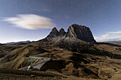 Starry sky on rocky peaks of Sassolungo, Sella Pass, Dolomites, South Tyrol, Bolzano province, Italy, europe
