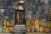 Facade of 9th century church, Sevanank Monastery, with propped up khachkars (carved memorial stones), Lake Sevan, Sevan, Armenia, Central Asia, Asia