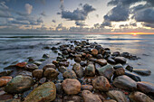 Rock breakwater in sea at sunrise, Munkerup, Kattegat Coast, Zealand, Denmark, Scandinavia, Europe
