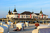 Beach chairs with people in front of sea bridge, Ahlbeck, Usedom, Ostseeküste, Mecklenburg-Western Pomerania, Germany