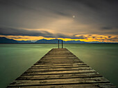 Autumn storm on Lake Chiemsee with view over the jetty to the Chiemgau Alps and Kaisergebirge, Chieming, Upper Bavaria, Germany