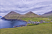 The village of Gjogv in between mountains and ocean, Eysturoy Island, Faroe Islands, Denmark, Europe