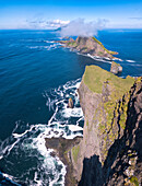 Panoramic of the sea stacks of Drangarnir and Tindholmur islet, Vagar Island, Faroe Islands, Denmark, Europe (Drone)