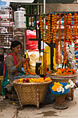 Flower garland seller on the streets of Kathmandu, Nepal, Asia