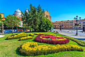 View of gardens in Prato della Valle and Santa Giustina Basilica visible in background, Padua, Veneto, Italy, Europe