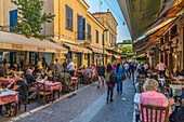 View of restaurants and cafes on Mitropleos during late afternoon, Athens, Greece, Europe