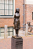 Statue of Anne Frank outside Westerkerk, Amsterdam, Netherlands, Europe