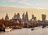 View over River Thames towards City of London at sunrise, London, England, United Kingdom, Europe