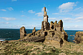 Stone ruins of Castle Sinclair Girnigoe against sky and clouds, Scotland, UK