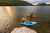 Couple kayaking on Jordan Pond in Acadia National Park, Maine, USA