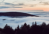 Mountain tops peak above an inversion on Maine's Cadillac Mountain, Acadia National Park.