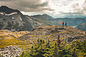 Father and son hiking on rocky ridge, Merritt, British Columbia, Canada
