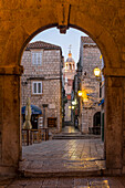View from the town gate of the old town of Korcula to the cathedral at dawn, Korcula, Croatia, Europe