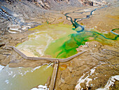 Dry manmade high altitude Lake Teleccio, Gran Paradiso National Park, Italy