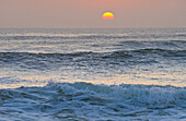 Sun setting over ocean, Cape Cross, Namibia