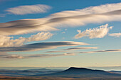 Lenticular clouds over tundra, Dempster Highway, Yukon, Canada