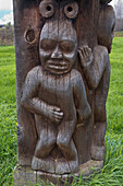 Wooden totem pole showing child, Kispiox, British Columbia, Canada