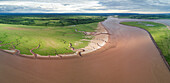 Maccan River estuary along dike and saltmarsh, Chignecto Bay, Nova Scotia, Canada