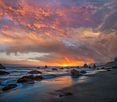 Sunset along coast near Arch Rock, California
