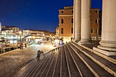 Night falls at the entrance to San Simeone Piccolo church in the sestier of Santa Croce, Venice, Italy.