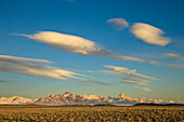 Lenticular and cumulus clouds above peaks, Fitzroy Massif, Los Glaciares National Park, Patagonia, Argentina
