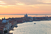 Sunset on Giudecca Island from the bell tower of San Giorgo Maggiore, Venice, Veneto, Italy.