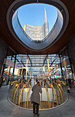 View of the Unicredit Tower spire and the artistic horns statue from Gae Aulenti square. Milan, Lombardy, Italy.