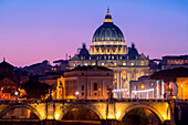 Rome, Lazio, Italy. Sunset on Tevere River, with Saint Peter Cathedral on the background.