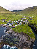 Panoramic of the village of Gjogv in between mountains and ocean, Eysturoy Island, Faroe Islands
