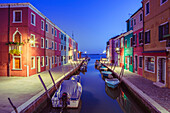 Canal and colorful houses in the evening on Burano Island, Venice, Italy