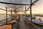 The lakefront restaurant of Punta San Vigilio on the eastern shore of Lake Garda, Verona province, Veneto, Italy.