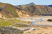 The Landmannalaugar campsite from the footpath to the Blahnukur mountain in Landmannalaugar (Landmannalaugar, Fjallabak Nature Reserve, Highlands, Southern Region, Iceland, Europe)