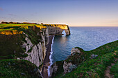 Arch in Etretat at sunrise ,Normandy,France.