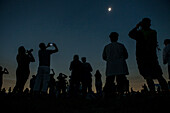 People watching and photographing total solar eclipse, Madras, Oregon