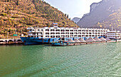 Gravel and car transports are just two of the industrial ships and barges that ply various portions of the Yangtze River. This the section of the river between Jingzhou and Chongqing.