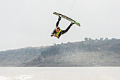 Wakeboarder performing high jump against sky, Aculco, State of Mexico, Mexico