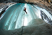 Professional climber, Francois Guy Thivierge of Canada, making his way up at the ice falls of  Pount Rouges in Quebec Region