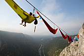 People sleeping in hammock and hanging on high line above mountains, Tijesno Canyon, Banja Luka, Bosnia and Herzegovina