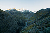 Hiker on a long distance hiking path at the Niederjochbach, E5, Alpenüberquerung, 6th stage, Vent,Niederjochbach, Similaun hut, Schnalstal, Vernagt reservoir, Meran